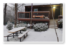 One of our cabins covered in snow